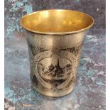 A Russian silver and niello flared cylindrical beaker, engraved with buildings, 9cm high, Mikhail