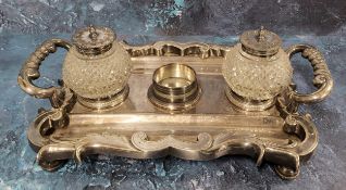 A 19th century Sheffield Plated two handled standish, with hobnail cut wells, bold scroll border,