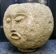 An unusual Derbyshire gritstone spherical trough, carved with a face, 33cm diameter x 30cm high