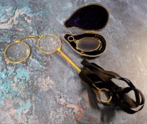 A pair of Victorian lorgnettes, posted handle, 14cm long; a pair of folding Pince-nez, cased (2)