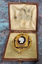 Attributed John Brogden, a Victorian yellow metal Etruscan style shell cameo mourning brooch, the