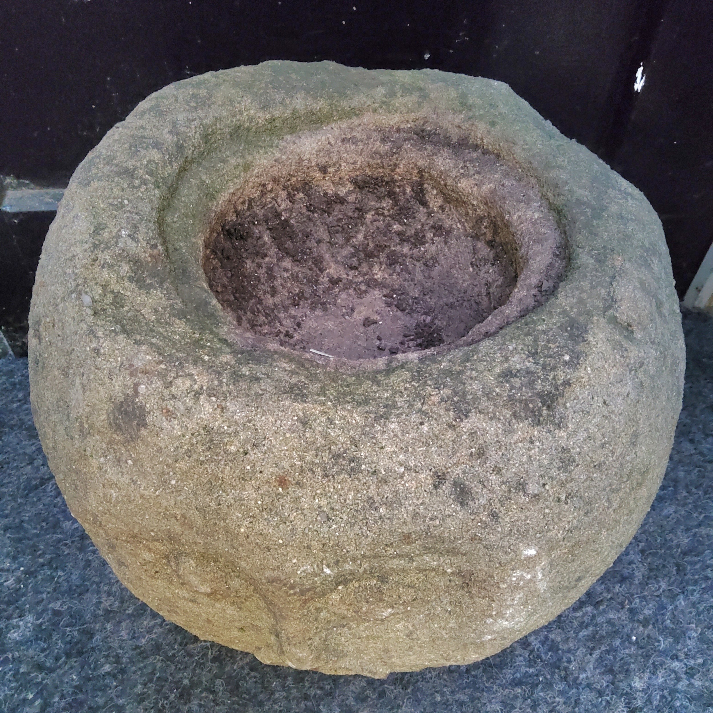 An unusual Derbyshire gritstone spherical trough, carved with a face, 33cm diameter x 30cm high - Image 3 of 5