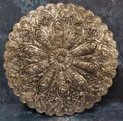 A Turkish/Ottoman silver-coloured metal wedding mirror, the verso embossed with radiating lower