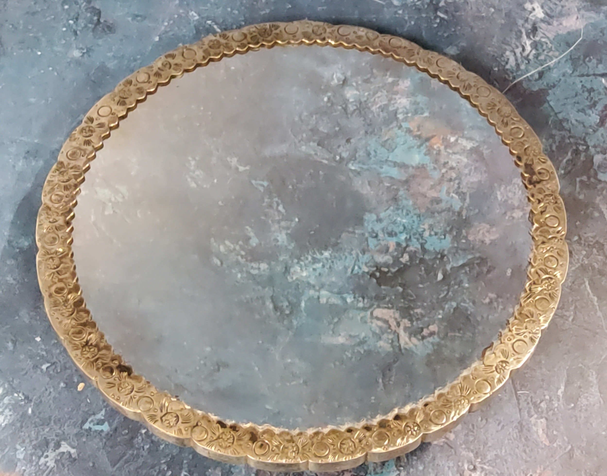 A Turkish/Ottoman silver-coloured metal wedding mirror,  the verso with repoussé scrolling - Image 2 of 2