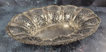 An Austrian silver oval scallop-shaped bread basket, chased & engraved scroll & foliate border,