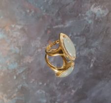 A 9ct gold navette shaped ring, set with a central navette shape pale blue stone, bordered by