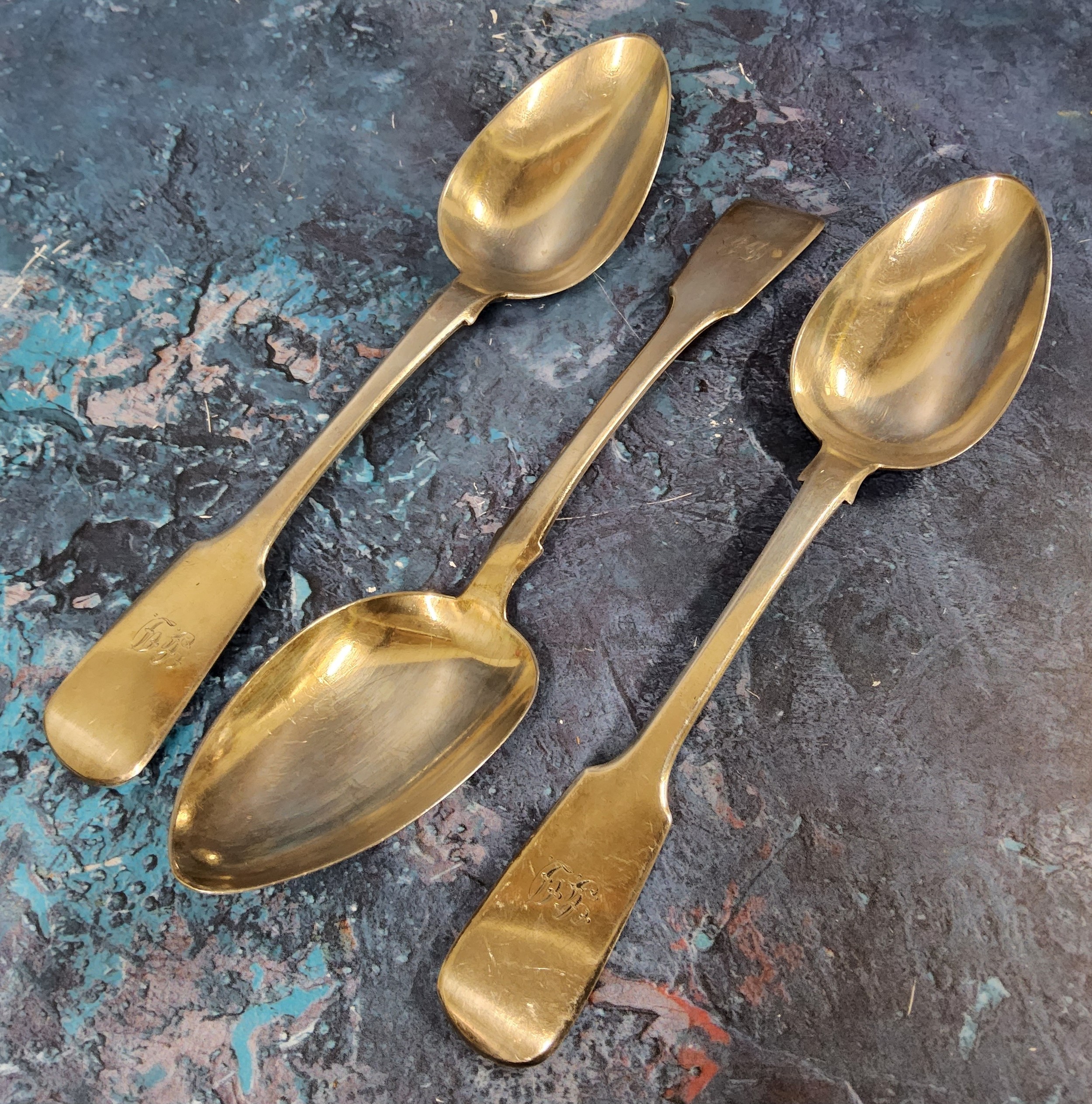 A pair of silver Fiddle table spoons, Edinburgh 1820;  another, Edinburgh 1818, 241g, 7.7toz