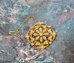 A Victorian 15ct gold floral brooch/pendant, the 'floating' centre in the form of a daisy head, a