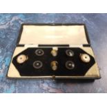 A gentleman's dress studs, four set with gilt metal and onyx, two with mother-of-pearl, two with cz,