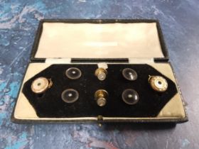 A gentleman's dress studs, four set with gilt metal and onyx, two with mother-of-pearl, two with cz,