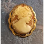 A 9ct gold mounted shell cameo brooch/pendant , the cameo depicting a Greek maiden