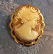 A 9ct gold mounted shell cameo brooch/pendant , the cameo depicting a Greek maiden