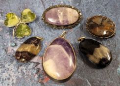 A polished Blue John specimen stone pendant; another (af); a white metal mounted agate brooch; a