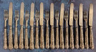 A set of nine Victorian Kings pattern silver fruit knives and forks, silver blades and prongs, the