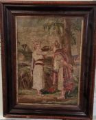 A Victorian woolwork, embroidered with figures taking a drink, possibly Moses, 41cm x 29cm, framed