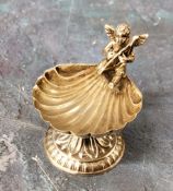 A sterling silver shell shaped salt, surmounted with a cherub, 4.75cm high, marked 925 Sterling, 39g