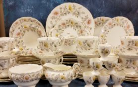 A Coalport dinner and tea service, for eight, comprising dinner, dessert and side plates, seven