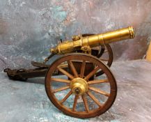 A desk top Gatling field gun,  modelled by Hartford Conn, brass ten barrel, applied plaque "