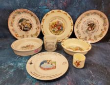 A Royal Doulton Bunnykins bowl, eggcup and plate;   a Wedgwood Peter Rabbit, mug, plate and bowl,