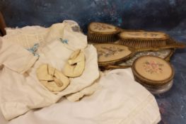 A mid 20th century child's christening gown;  another, cotton;  a pair of Rock-a-Bye shoes;  ;   a