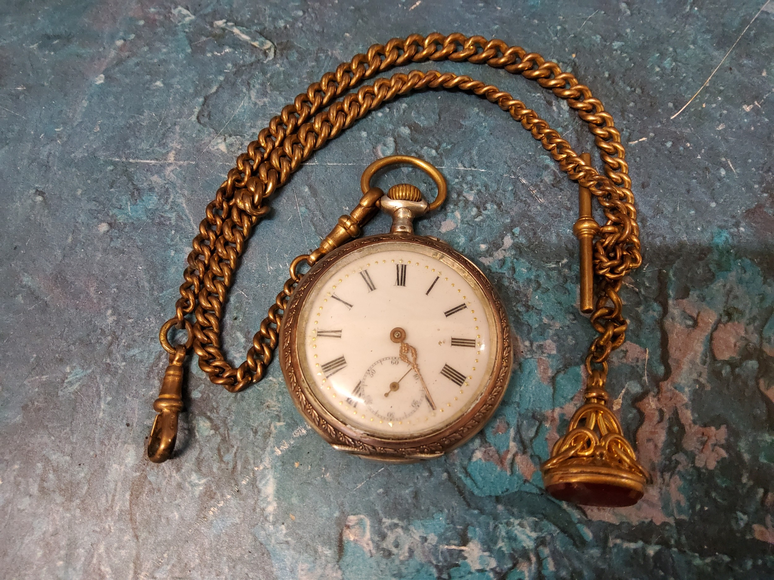 A silver coloured metal open faced pocket watch, marked *-800;  a gold plated double Albert,
