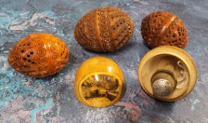 Three 19th century coquilla nut pomanders or flea catchers, each egg carved and pierced, largest