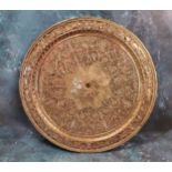 A Victorian electrotype circular plaque/charger, in relief with a radiating flower, the rim with