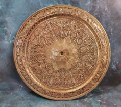 A Victorian electrotype circular plaque/charger, in relief with a radiating flower, the rim with