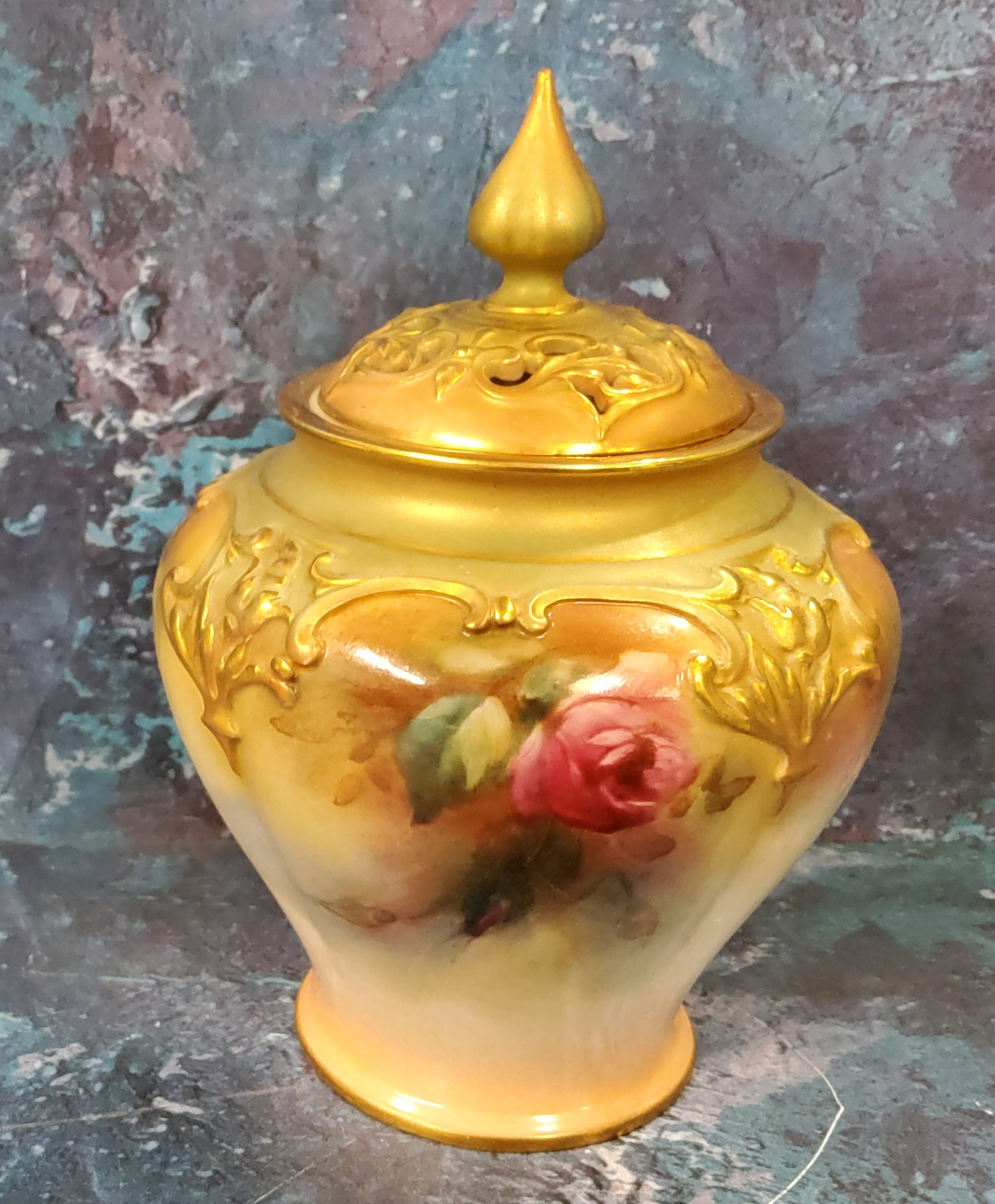 A Royal Worcester James Hadley lobed ovoid pot pourri vase and cover,  painted with pink and