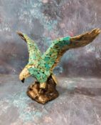 A Duncan Enterprises Company ceramic eagle, perched with wings outstretched, applied with