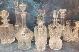 Cut glass decanters, ships, bottle, canted square and others;   cut glass water jug;  preserve pot