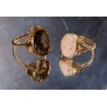 A vintage 9ct gold dress ring set with an oval smokey topaz, size P, 4.51g; a 9ct gold pink coral