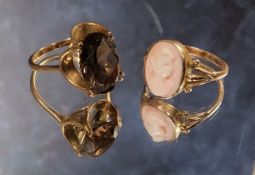 A vintage 9ct gold dress ring set with an oval smokey topaz, size P, 4.51g; a 9ct gold pink coral