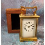 A French gilt carriage clock, Roman numerals, swing handle, 14.5cm high, morocco case