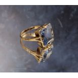 A Dutch 14ct gold cocktail ring, set with an emerald cut blue topaz, size M 1/2, 3.85g gross