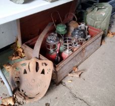 Salvage - a Pierce tractor seat, Tilley lamps and a Jerry can housed in an early 20th century