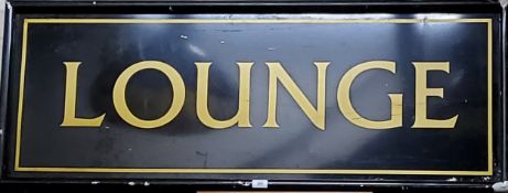A substantial LOUNGE metal sign