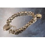 An 18th century cut steel part chatelaine chain reworked as a bracelet, later silver padlock clasp &