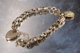 An 18th century cut steel part chatelaine chain reworked as a bracelet, later silver padlock clasp &