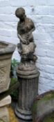 Garden Statuary - a reconstituted stone statue of a maiden making tea on fluted plinth base
