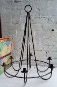 A wrought iron six branch chandelier