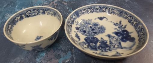 A Chinese Bat pattern tea bowl and saucer, decorated with bat, vase of flowers and fence, 12cm diam,