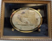 A George III silk needlework, embroidered  with a maiden and Cupid, oval, 14cm x 20cm, framed