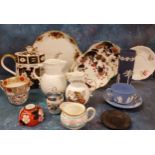 A Wedgwood blue Jasperware teacup and saucer, impressed mark;  a Wedgwood Jasper spill vase,