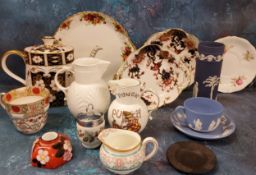 A Wedgwood blue Jasperware teacup and saucer, impressed mark;  a Wedgwood Jasper spill vase,