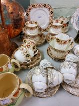 A Gladstone China tea service;  a Royal Staffordshire tea service;  a pair of graduated ovoid jugs;