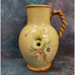 A Denby stoneware jug, painted with flowers, on an olive ground, rope twist handle, printed mark