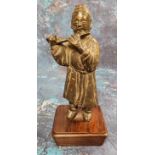 Chinese School, possibly 17th century, a dark patinated bronze, of a musician playing a flute,