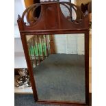 An early 20th century mahogany rectangular mirror, pierced arched top, 97cm x 56cm