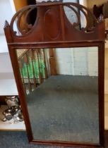 An early 20th century mahogany rectangular mirror, pierced arched top, 97cm x 56cm